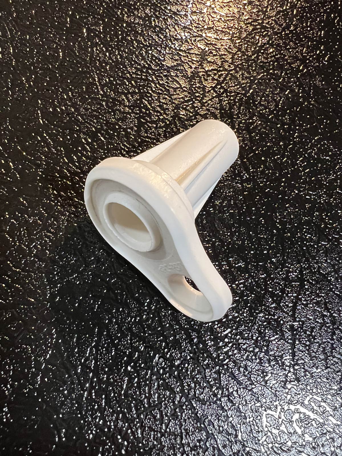 white injection molded sensor holder with structural ribs