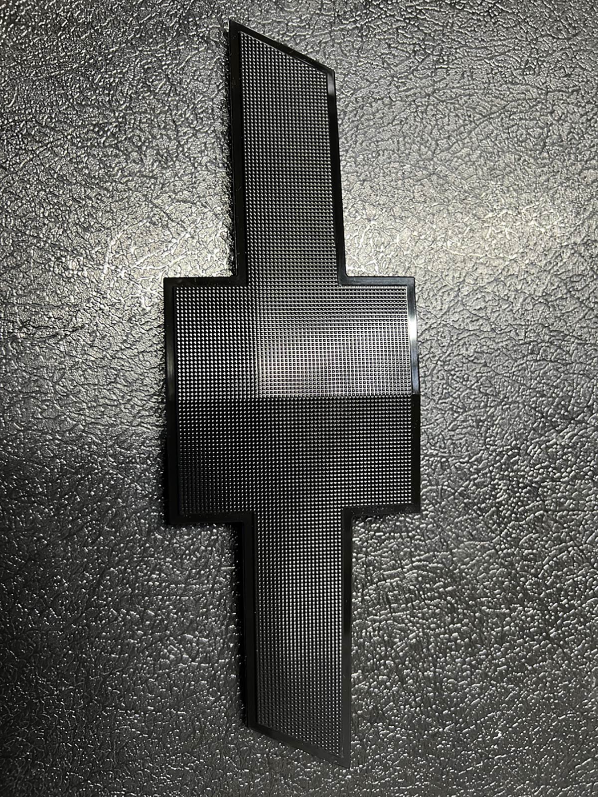 automotive part - black plastic injection molded chevy emblem